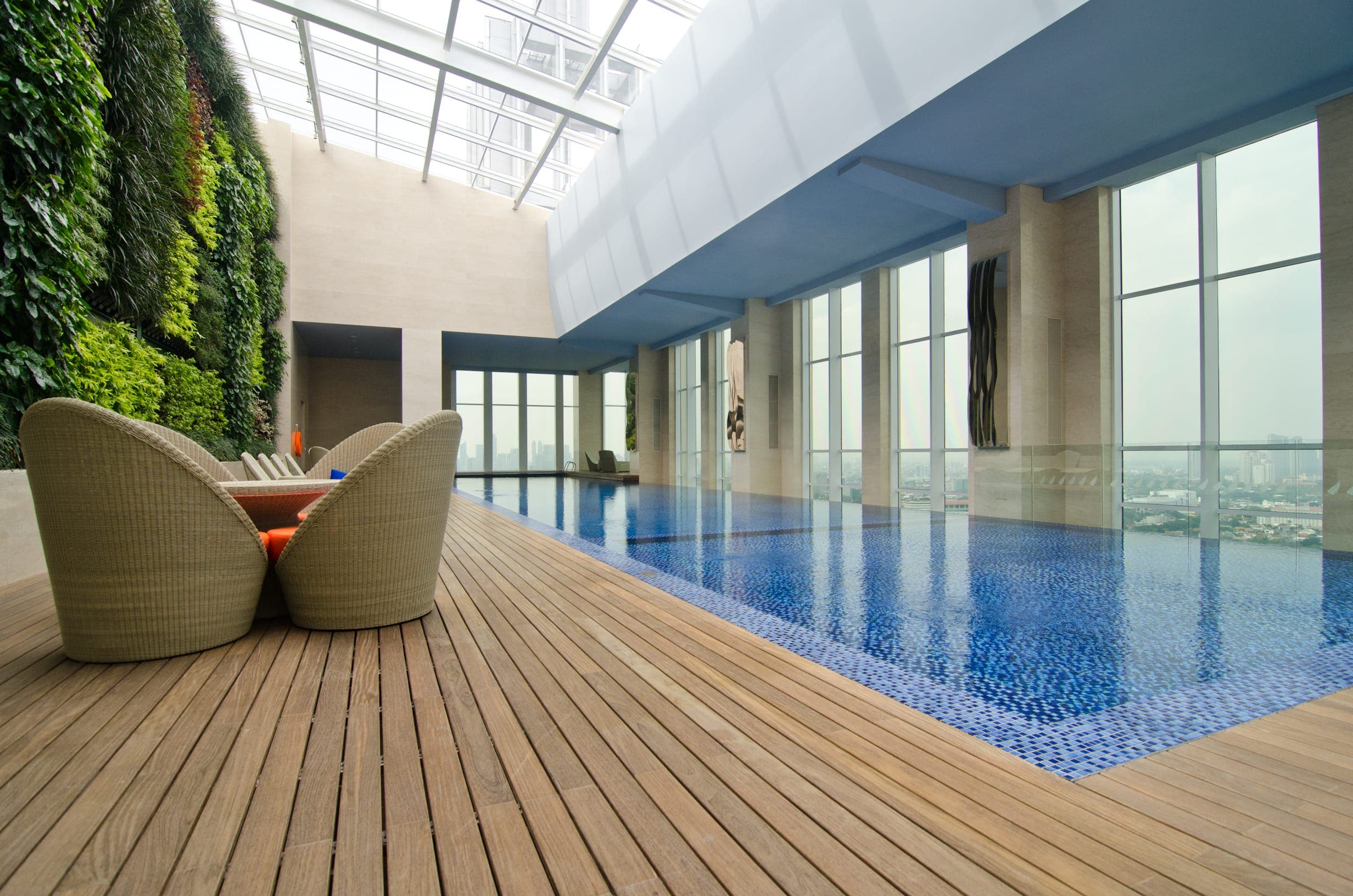 Terrass en bois en teak Incredible inside interior luxury pool in Indonesia with teak wood decking on softline system invisible fixation by Vetedy